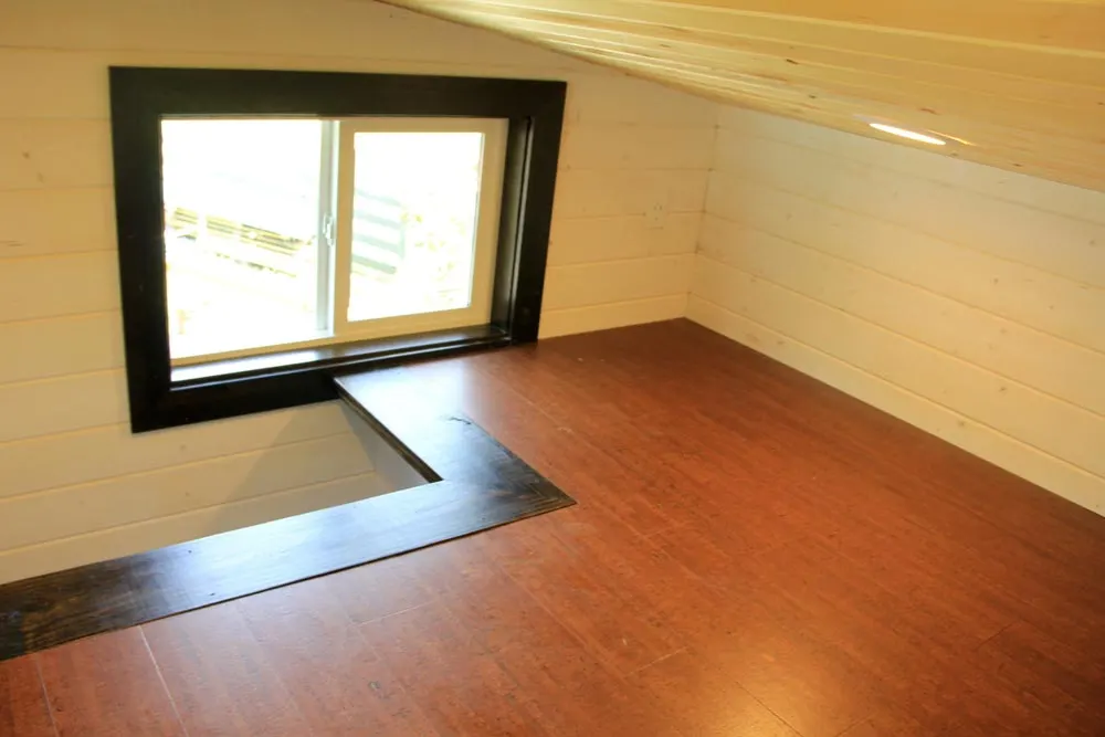Main loft with stair access in back - Fort Austin by Brevard Tiny House