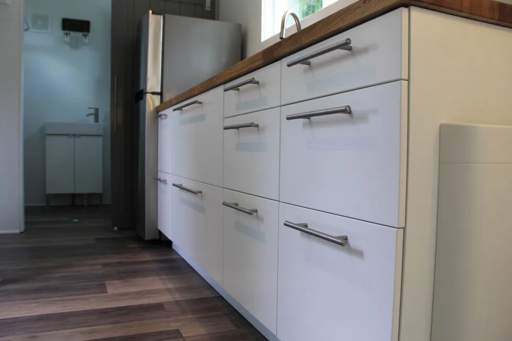 White kitchen cabinets detail - Every Tiny Moment by Brevard Tiny House