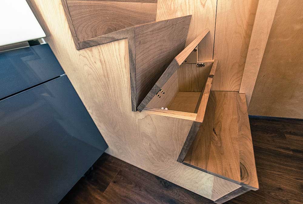 Modern stairs with storage space - Roanoke by Tumbleweed Tiny House