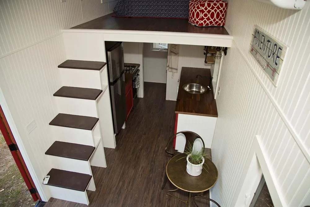 Storage stairs leading to king bed master loft - American Pie by Perch & Nest