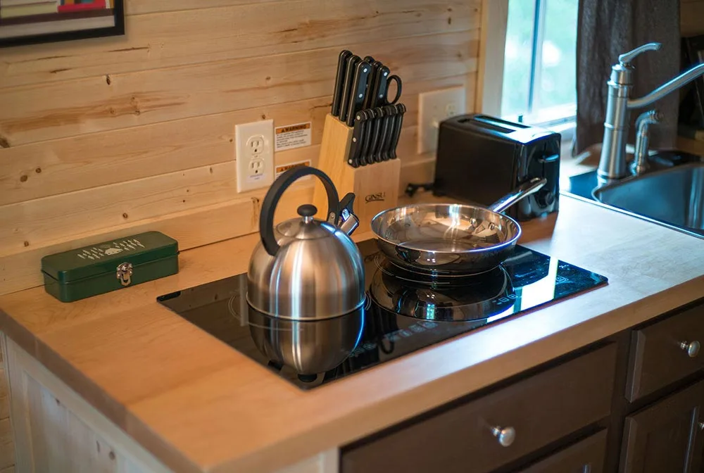 Cooktop with pot and pan - Lincoln at Mt. Hood Tiny House Village