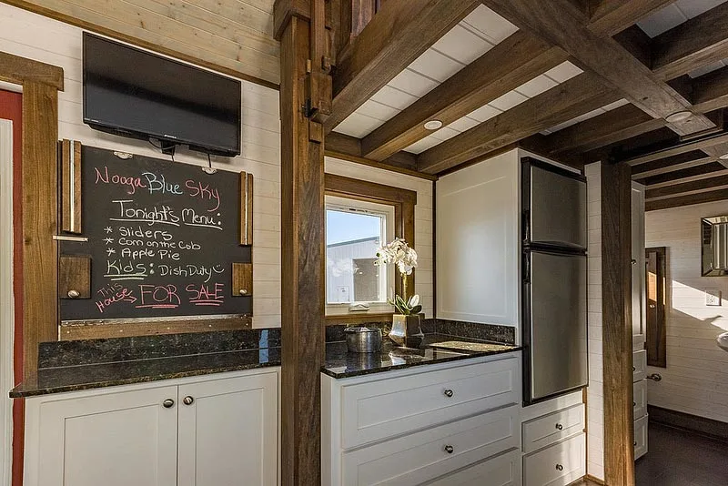 Kitchen with box beam ceiling - Nooga Blue Sky by Tiny House Chattanooga