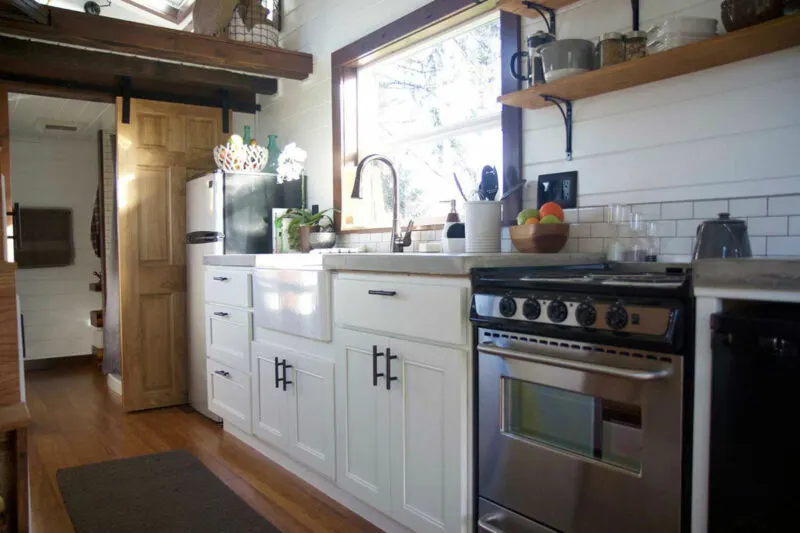 Full kitchen with concrete countertops - Northwest Haven by Tiny Heirloom