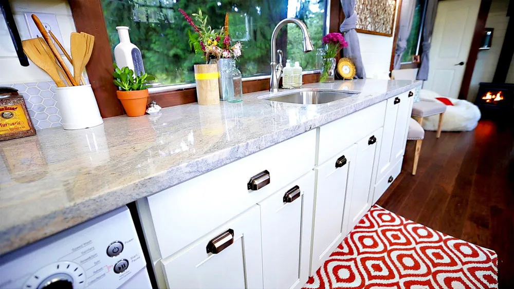 White kitchen cabinets and light granite countertop - Vintage by Tiny Heirloom
