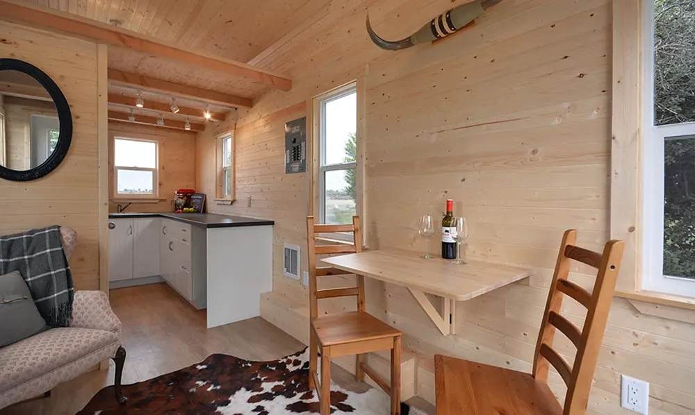 Dining and kitchen areas - Cabin in the Woods by Mint Tiny Homes