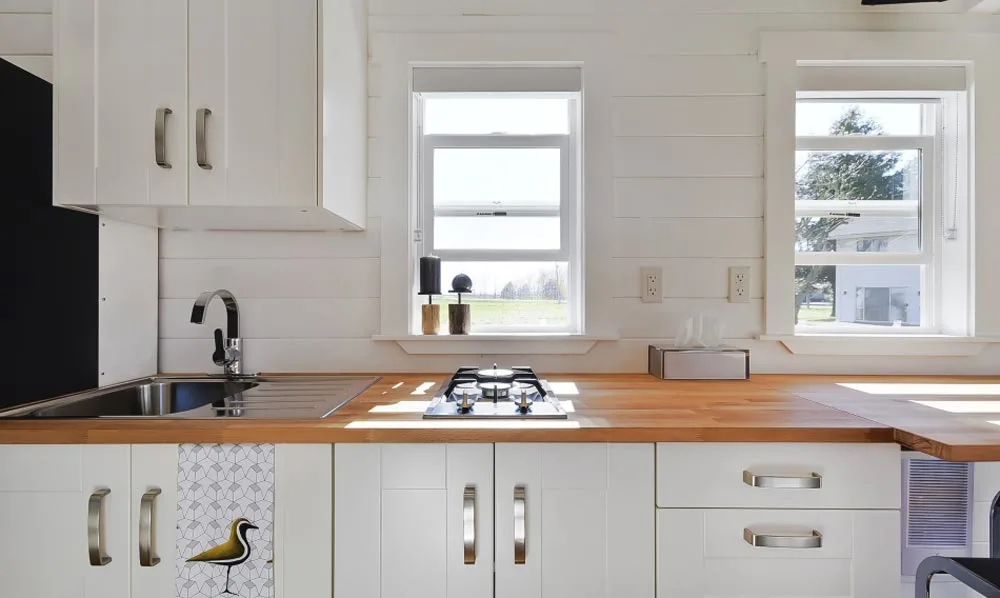 Kitchen Cabinets & Window - Custom Tiny by Mint Tiny Homes