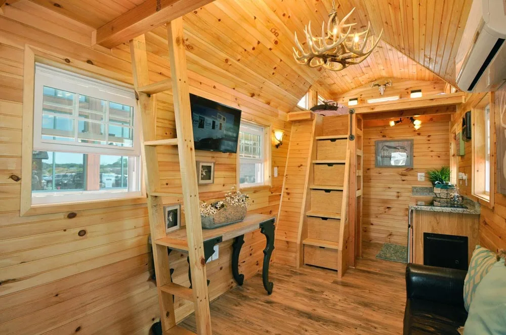Storage stairs and ladder to bedroom lofts - Mountaineer by Tiny House Building Company