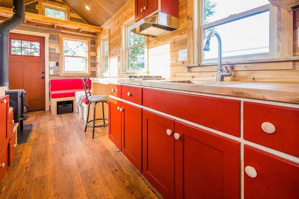 Red Cabinets - Davis' Off-Grid Tiny House by Mitchcraft Tiny Homes