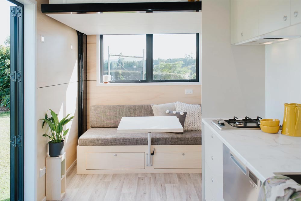 Living Room w/ Table - Camper Tiny House by Build Tiny
