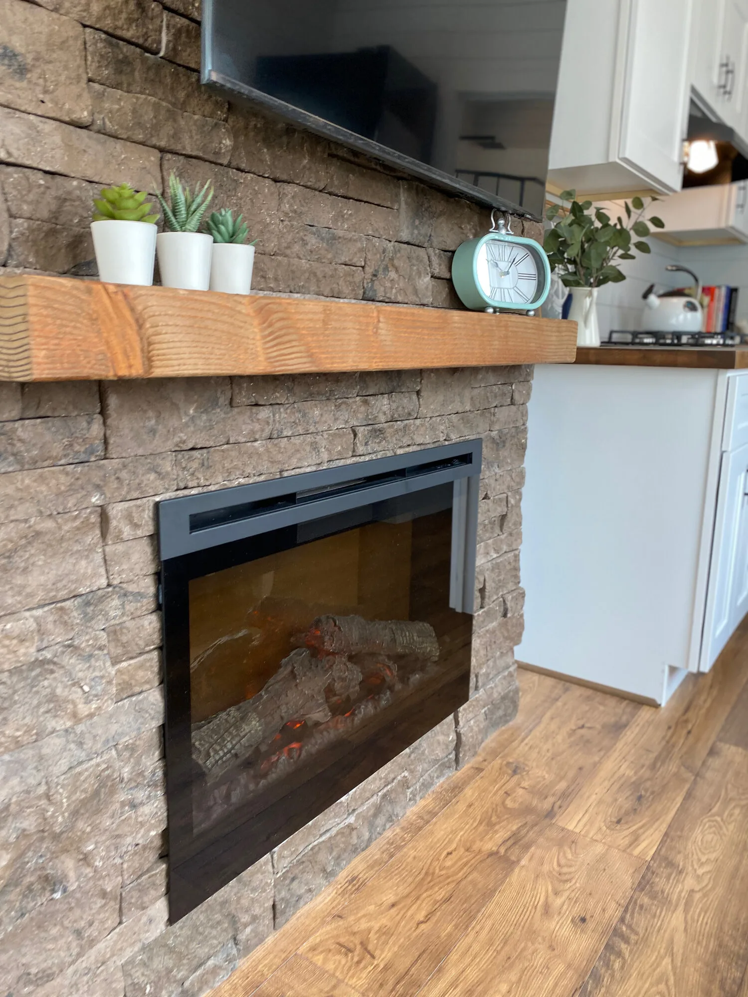 Fireplace w/ Mantle - Lauren's Flat by Uncharted Tiny Homes