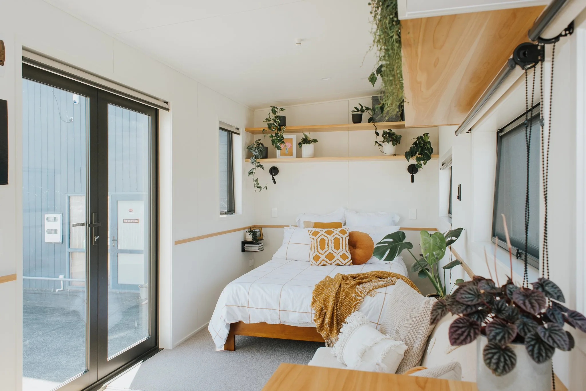 Tadpole Tiny House by Build Tiny - Entry & Bed Area