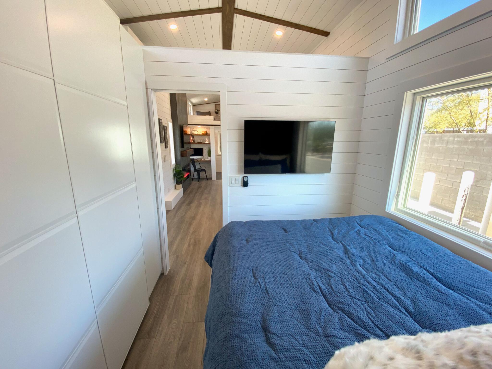 Bedroom with TV - Jen's Château by Uncharted Tiny Homes