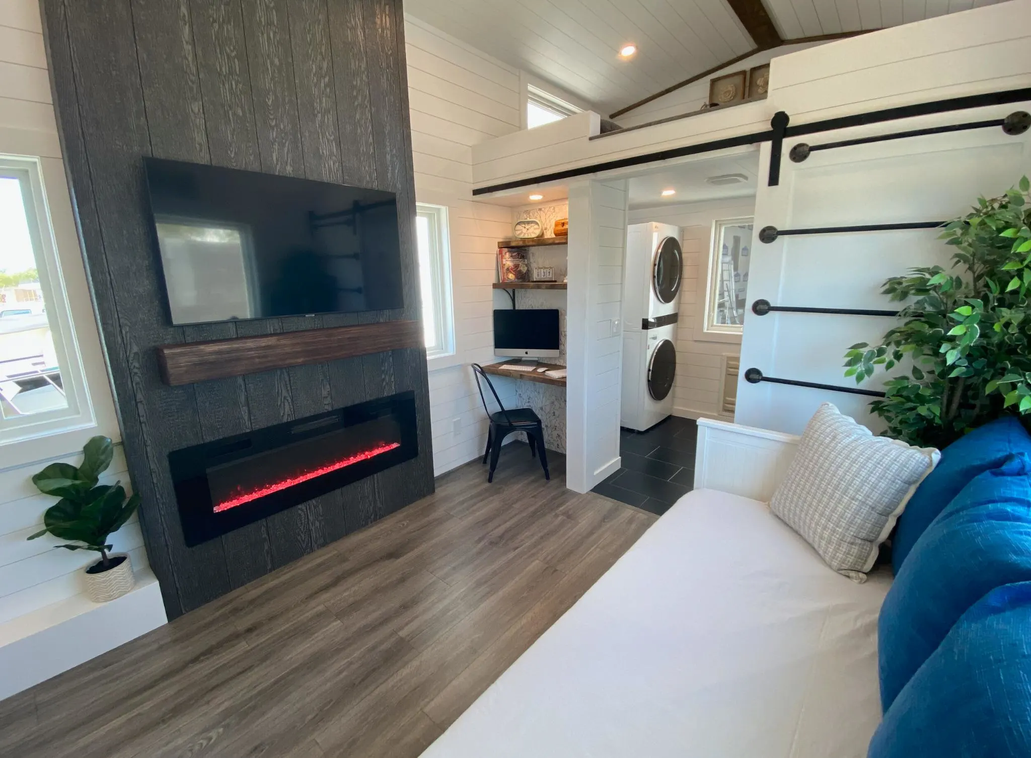 Entertainment Center and Fireplace - Jen's Château by Uncharted Tiny Homes