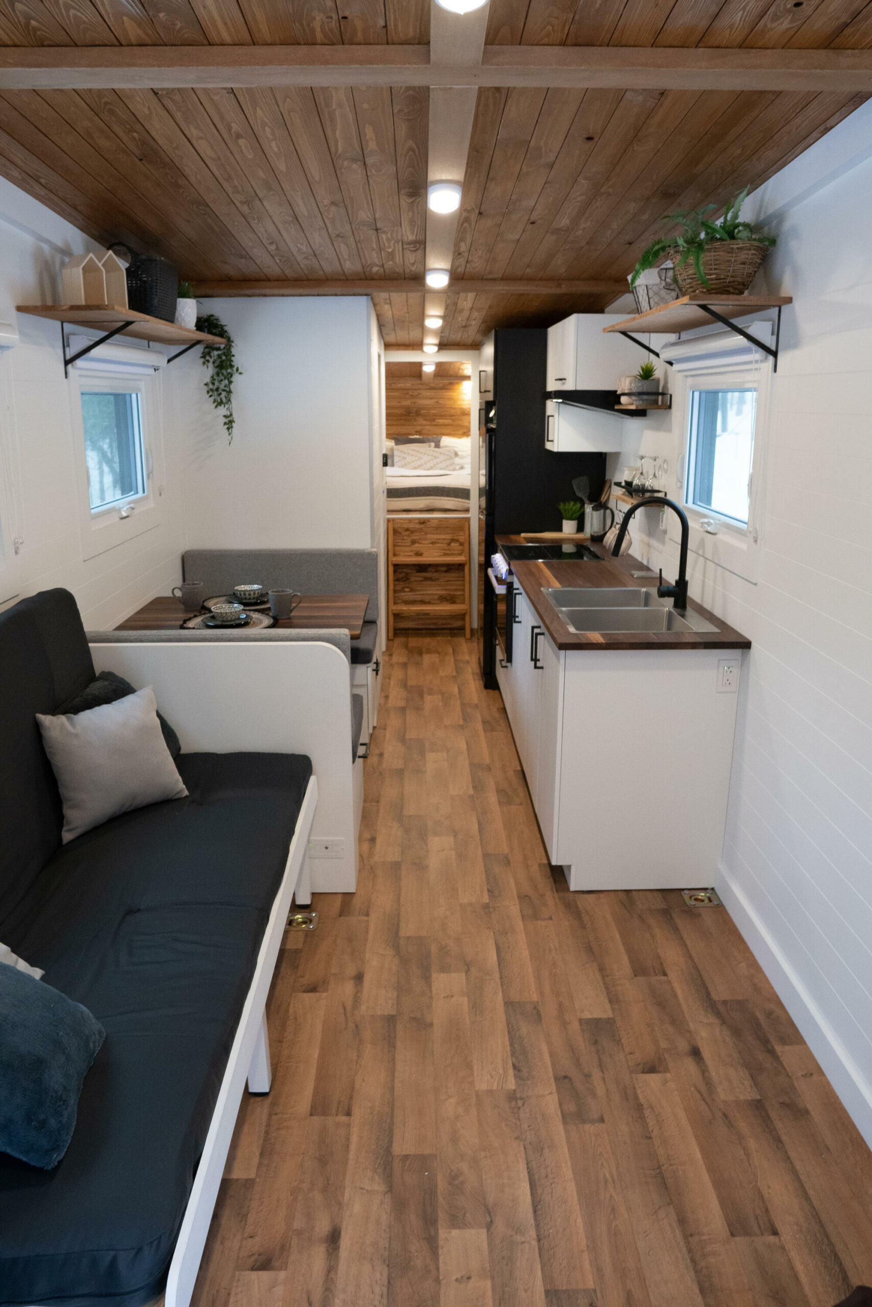 Living Area with Built-In Couch - Nomad 5th Wheel by Minimaliste