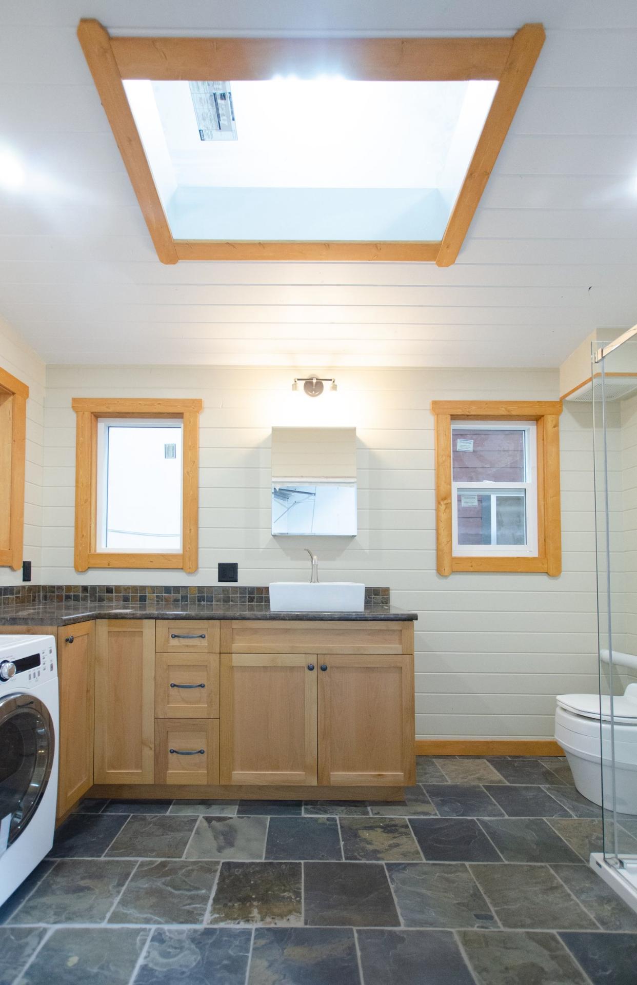 Bathroom with Skylight - Big Red by Rewild Homes