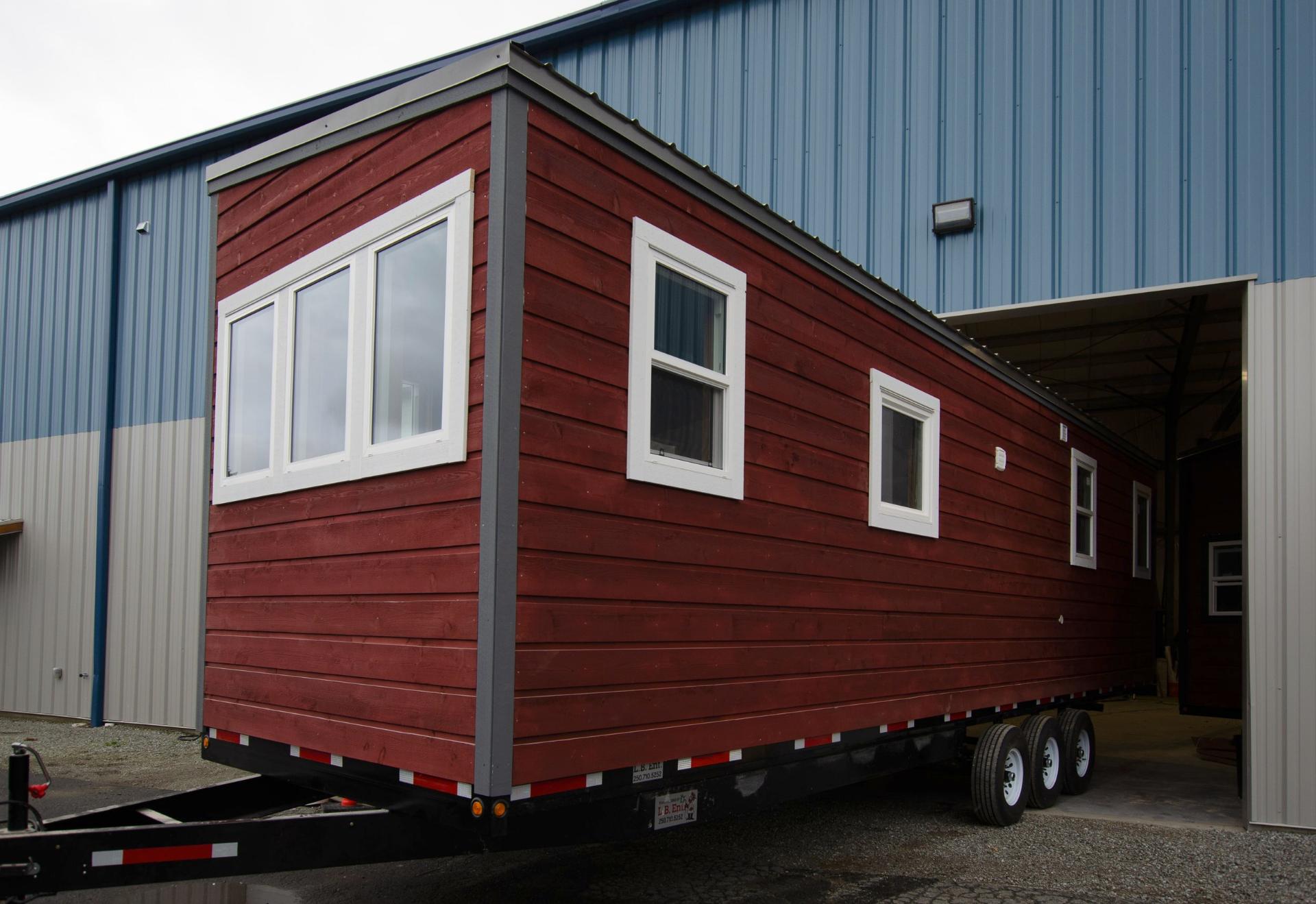 Tiny House Coming Out of the Shop - Big Red by Rewild Homes