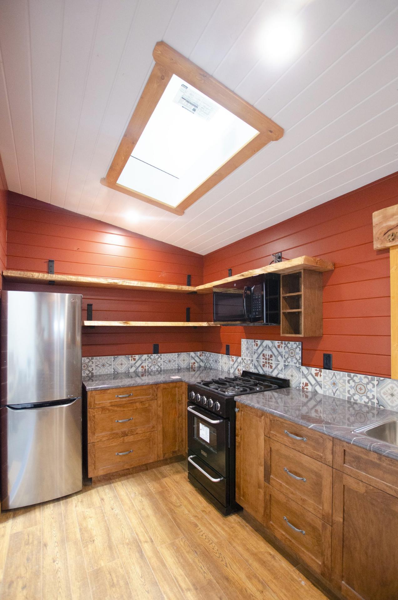 Kitchen with Skylight - Big Red by Rewild Homes