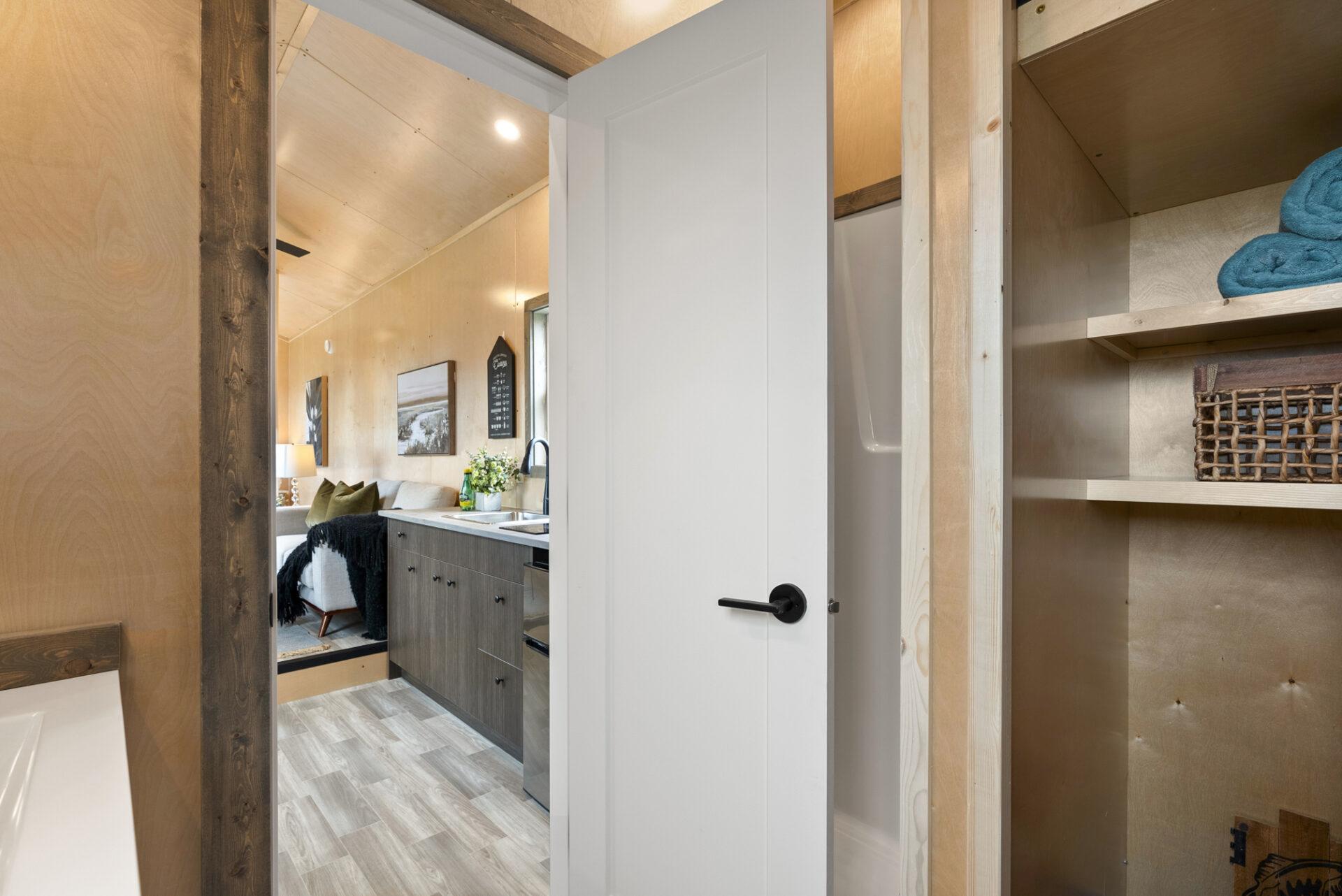 Bathroom Entry with White Door - Denman by Rover Tiny Homes