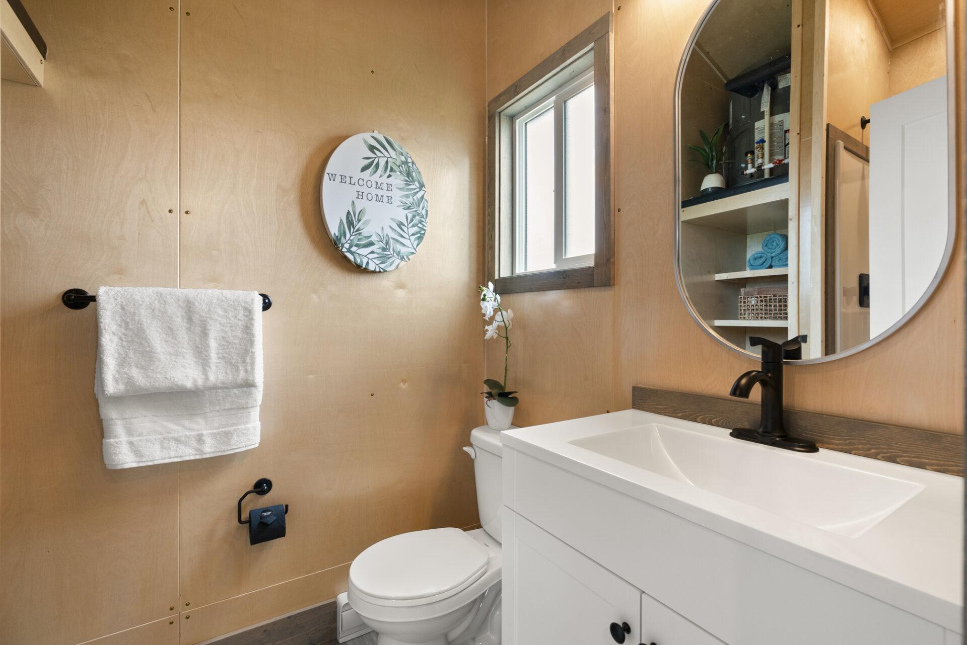 Bathroom with White Sink and Flush Toilet - Denman by Rover Tiny Homes