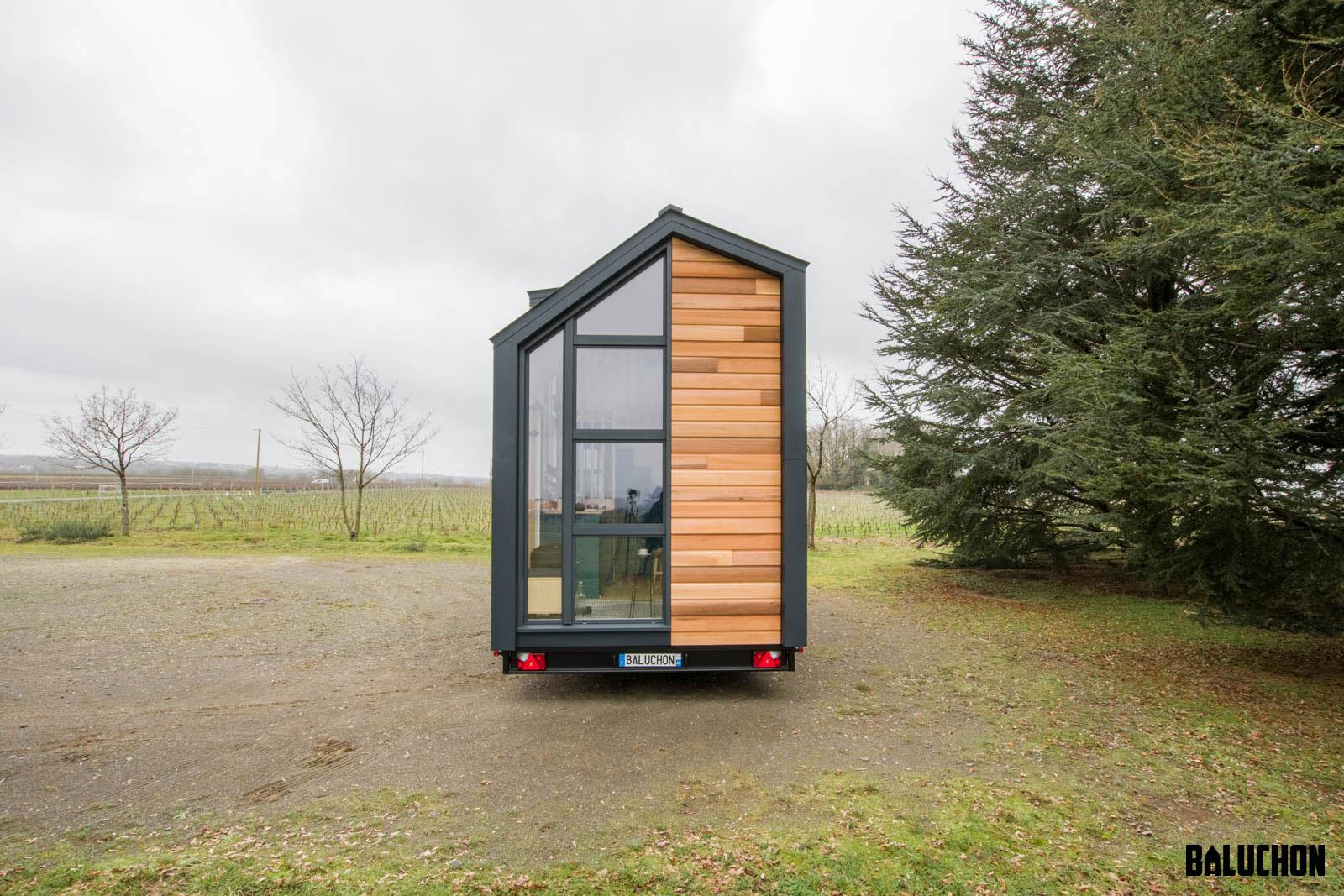 End of Tiny House With Windows and Wood Siding - Sherpa by Baluchon
