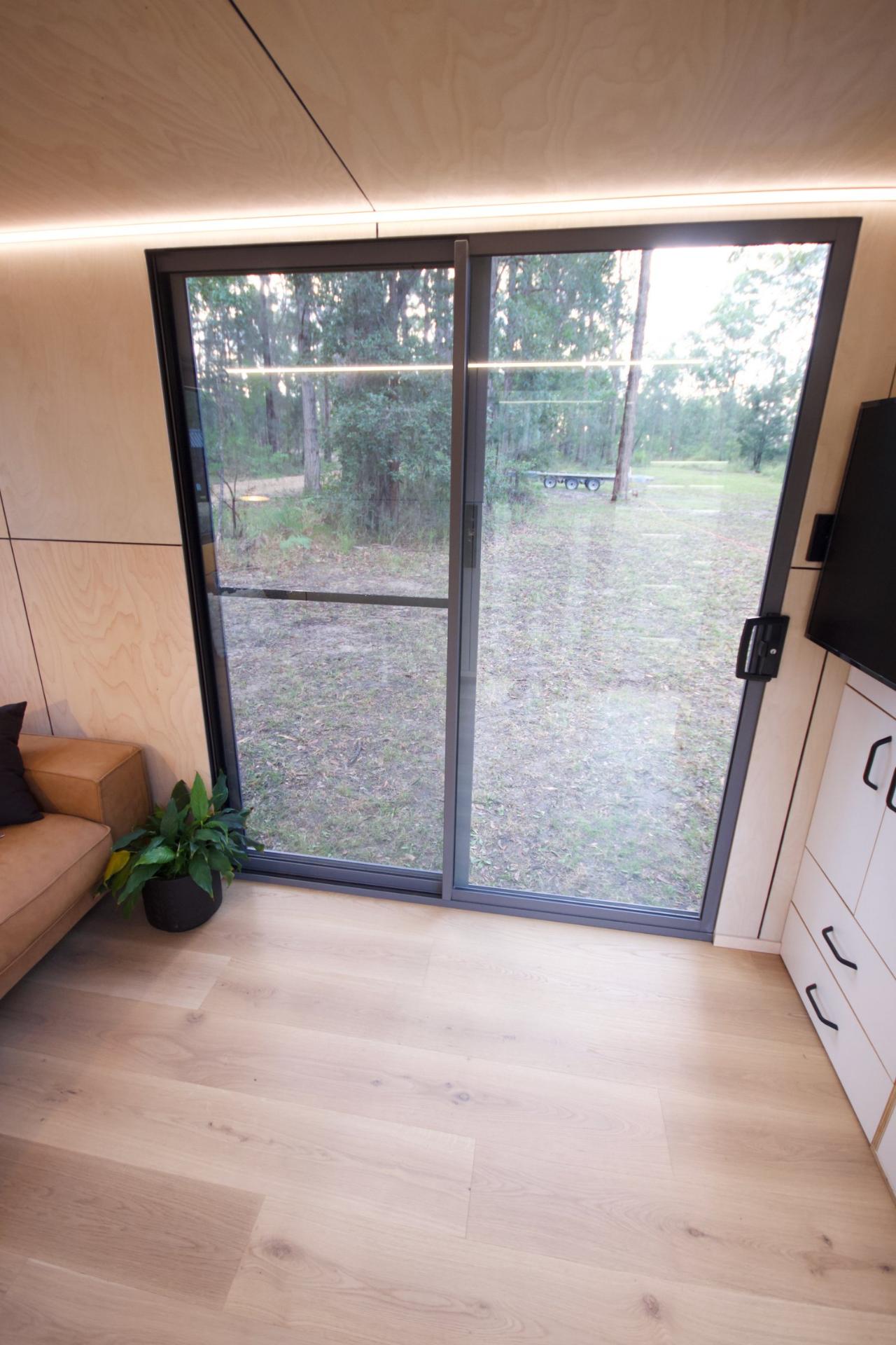 Sliding Glass Door in Living Room - GrandHaus by Häuslein Tiny House Co