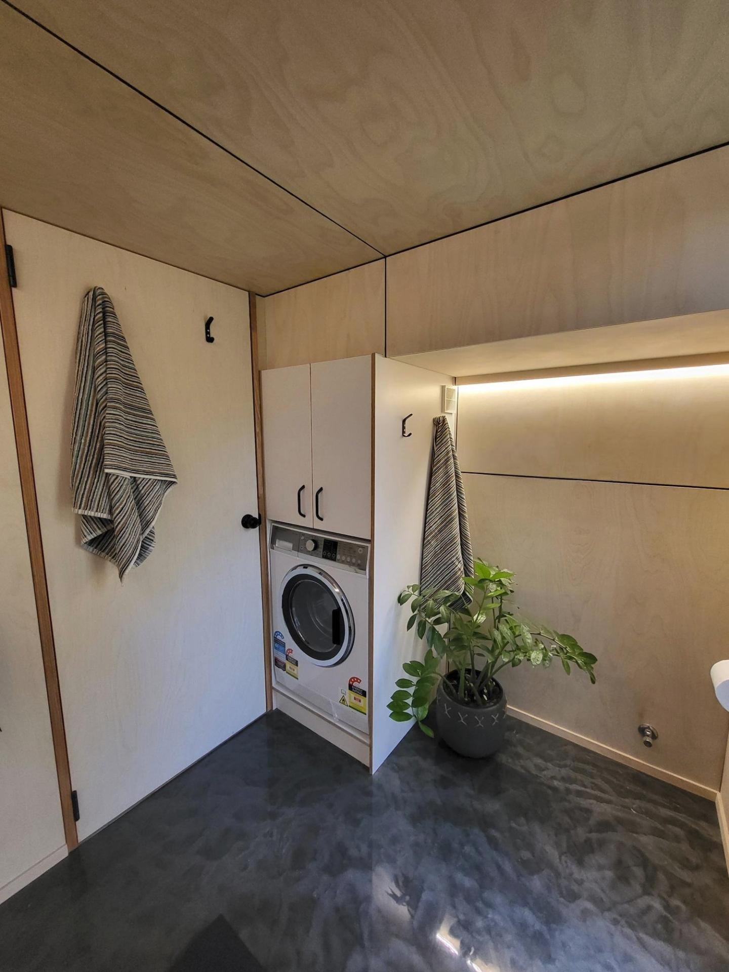 Washer in Bathroom - GrandHaus by Häuslein Tiny House Co