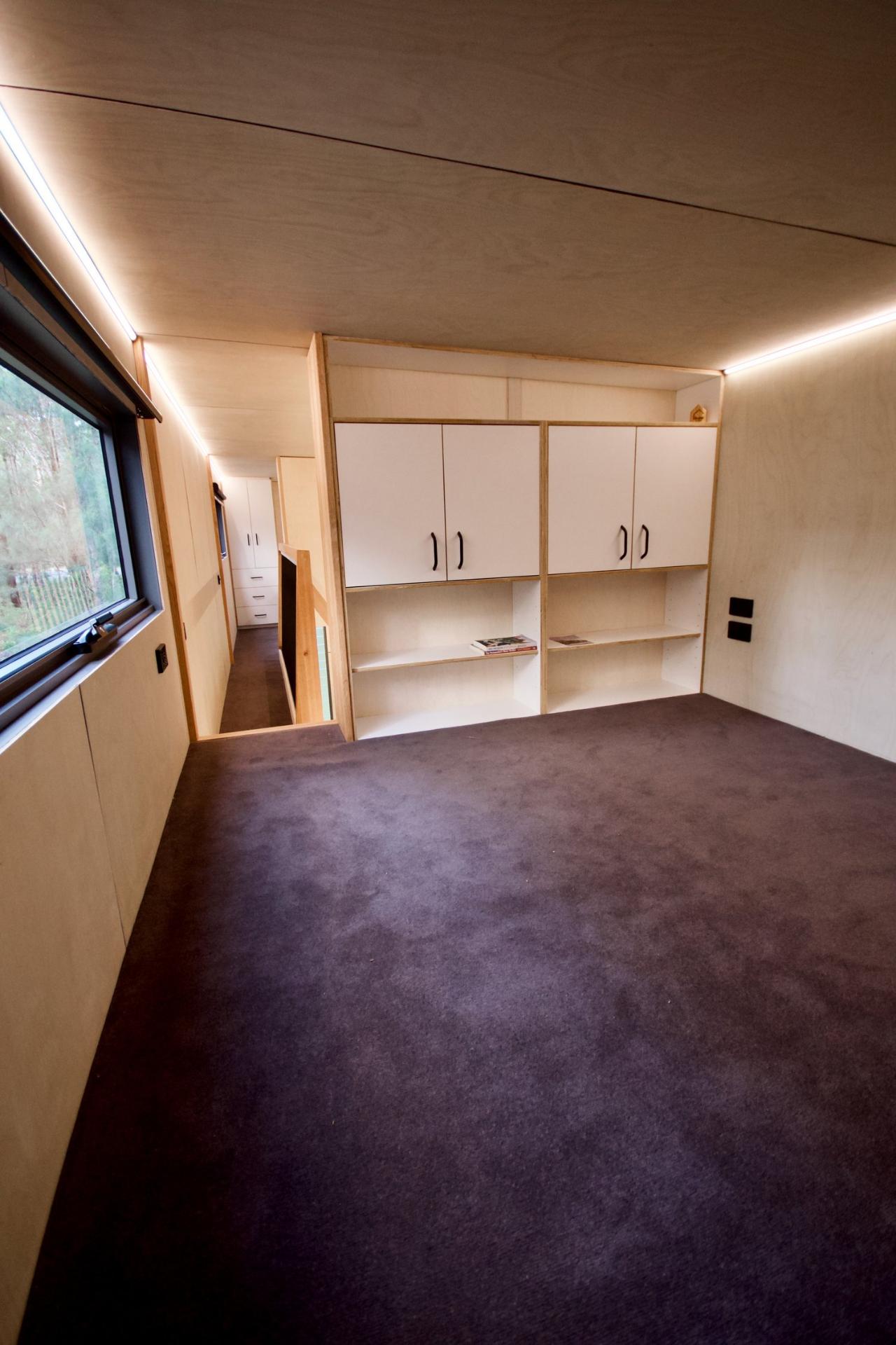 Guest Bedroom Loft with Cabinets - GrandHaus by Häuslein Tiny House Co