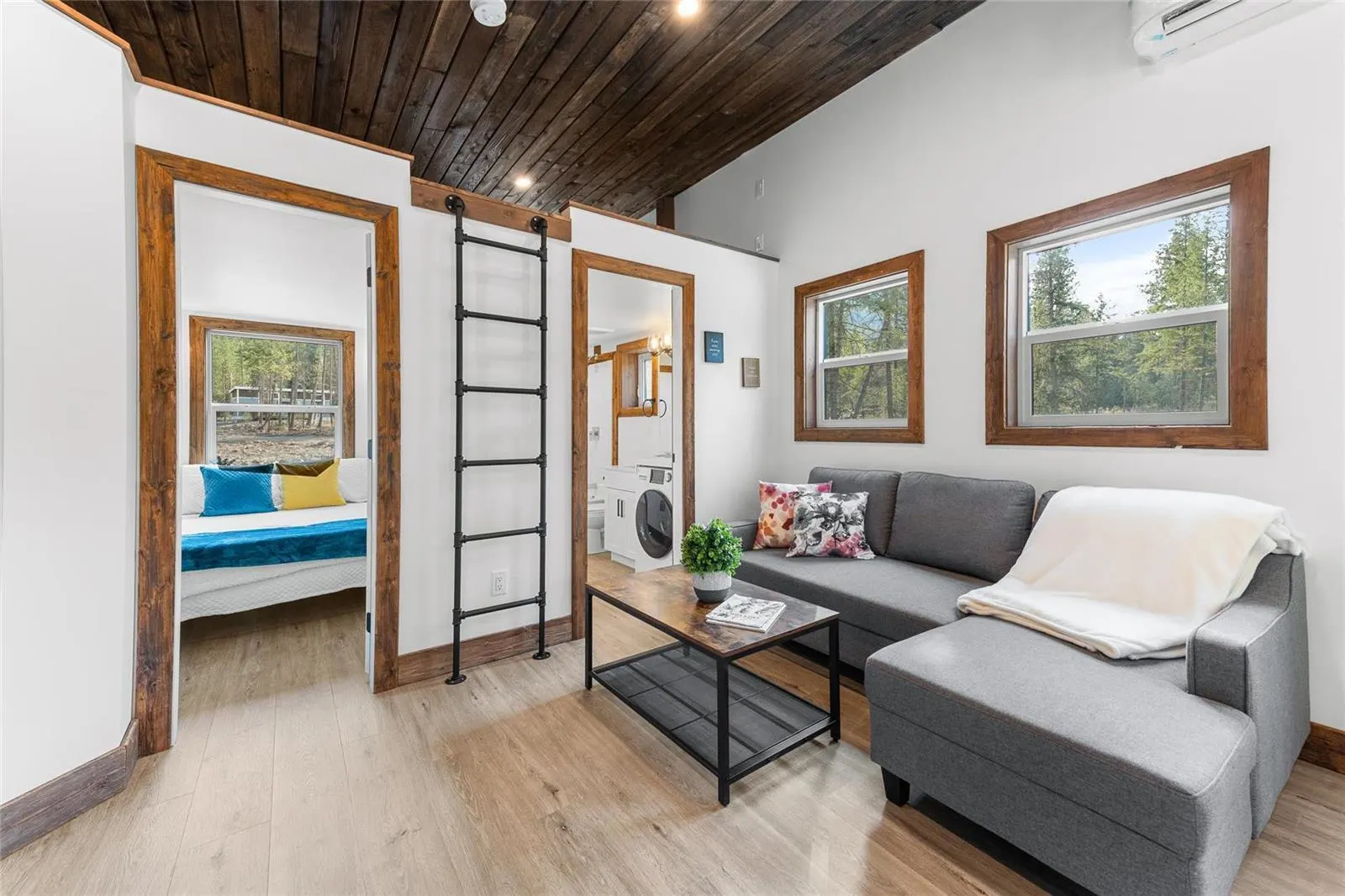 Living Room with Large Gray Couch - Hemlock by Rover Tiny Homes