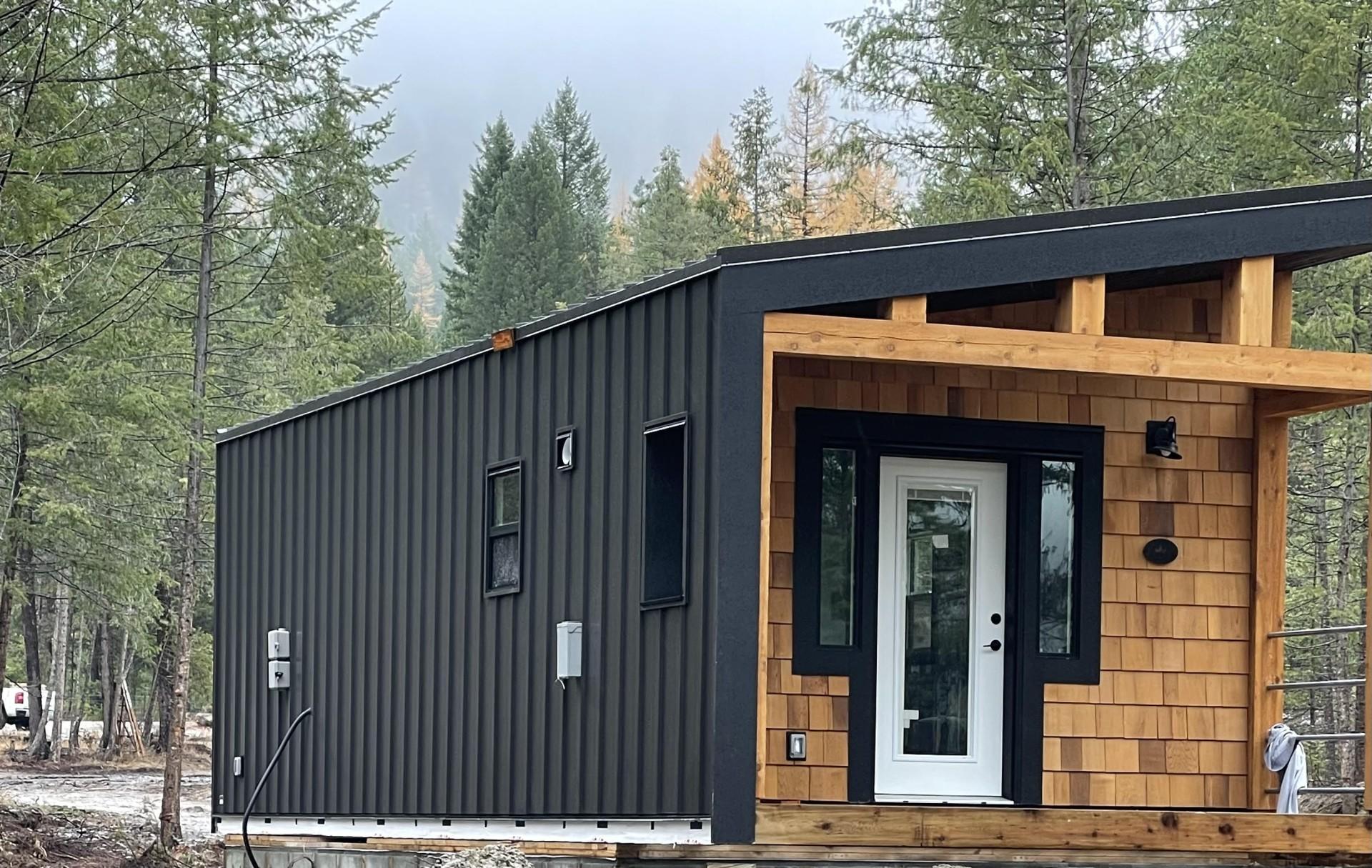 Tiny Cabin with Black Siding - Hemlock by Rover Tiny Homes