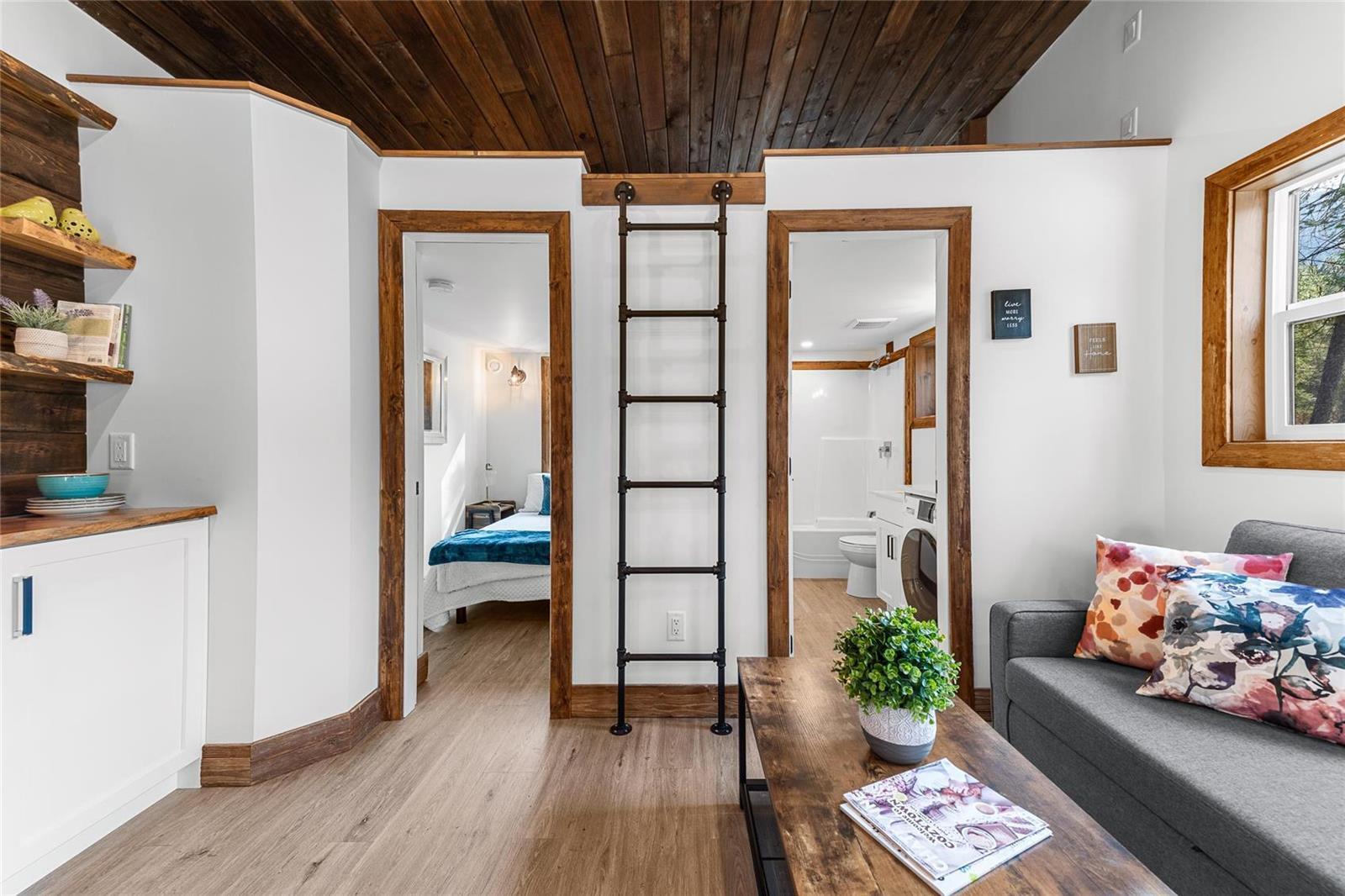 Living Room with Ladder Leading to Loft - Hemlock by Rover Tiny Homes