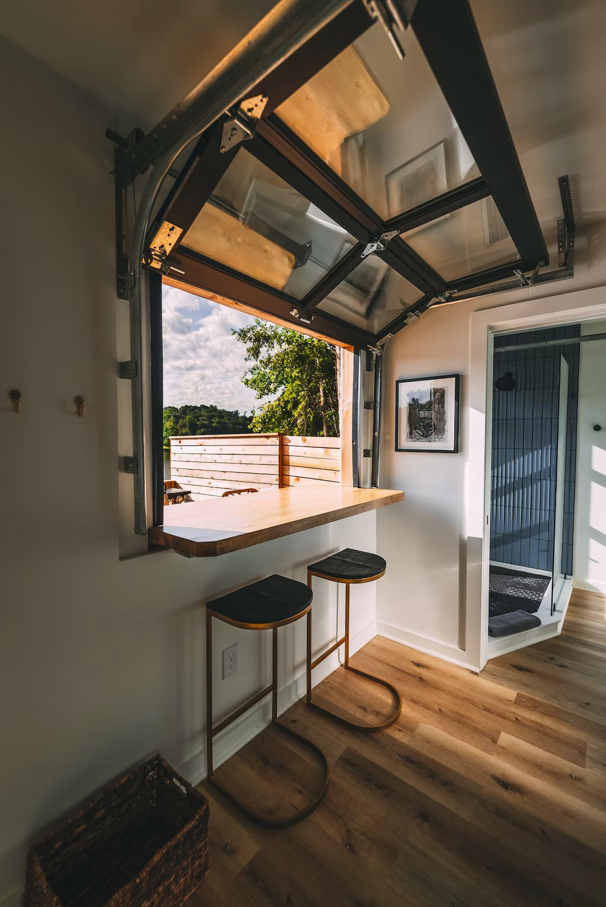 Bar with Garage Door Window - The Hive at Addison Farms