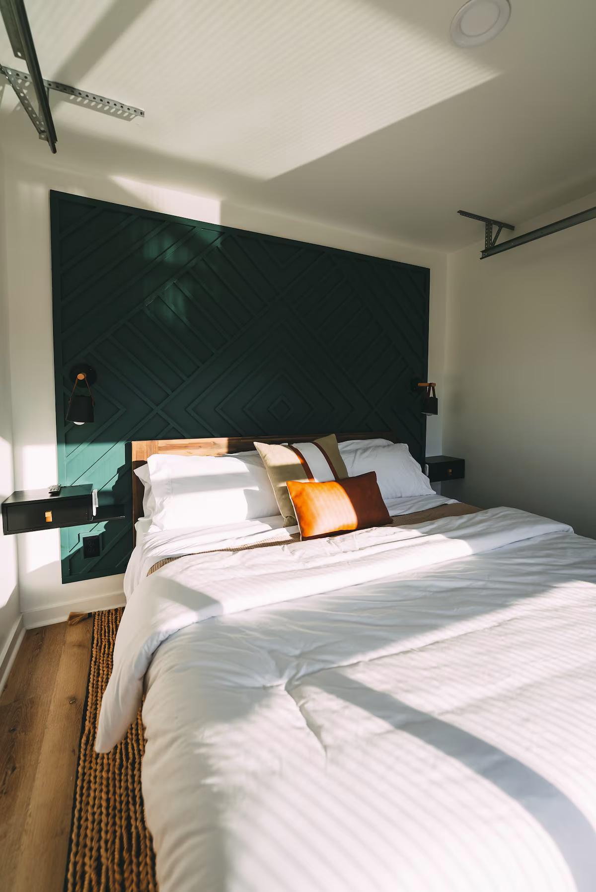 King Bedroom with Teal Blue Headboard - The Hive at Addison Farms