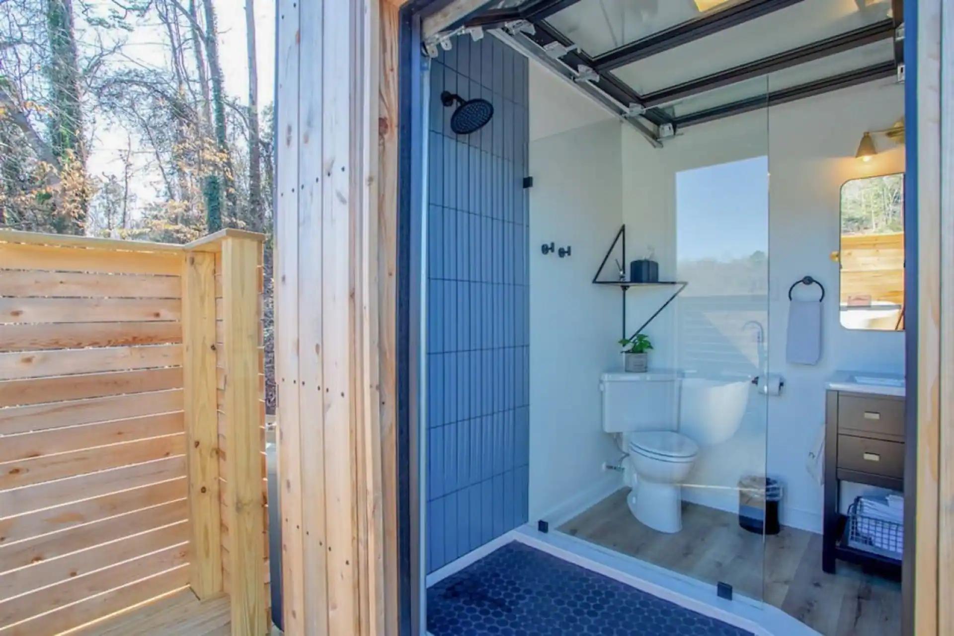 Bathroom with Garage Door - The Hive at Addison Farms