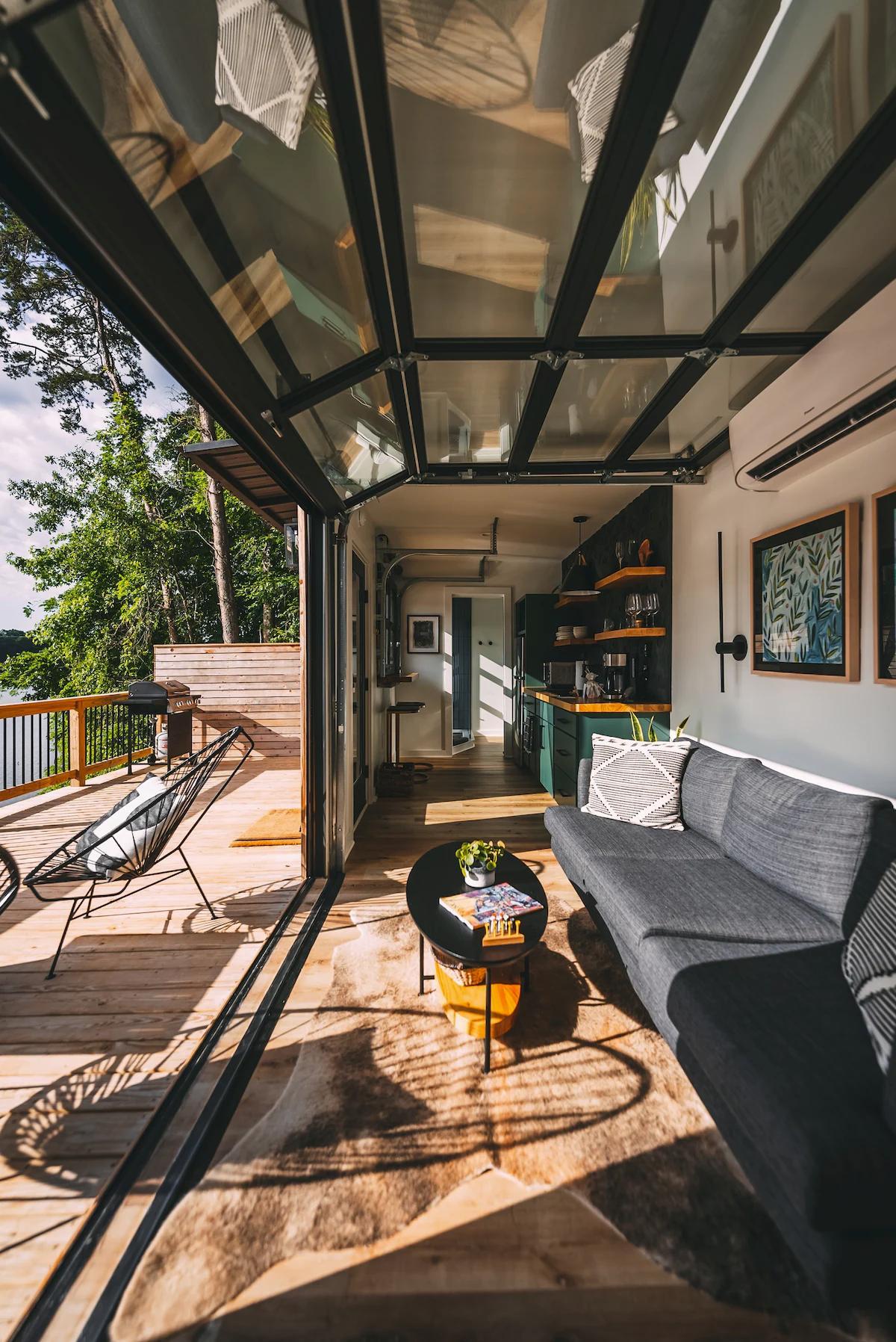 Living Room with Garage Door - The Hive at Addison Farms