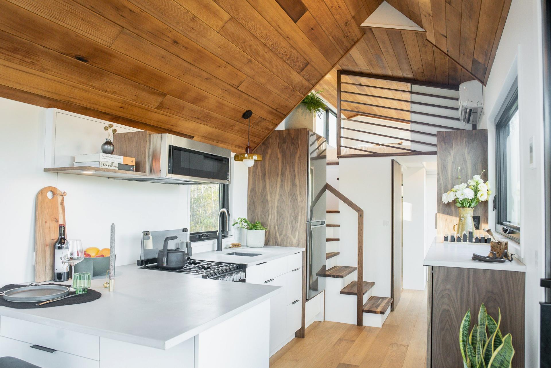 White Kitchen with Stained Wood Ceiling - Halcyon Lux by Fritz Tiny Homes