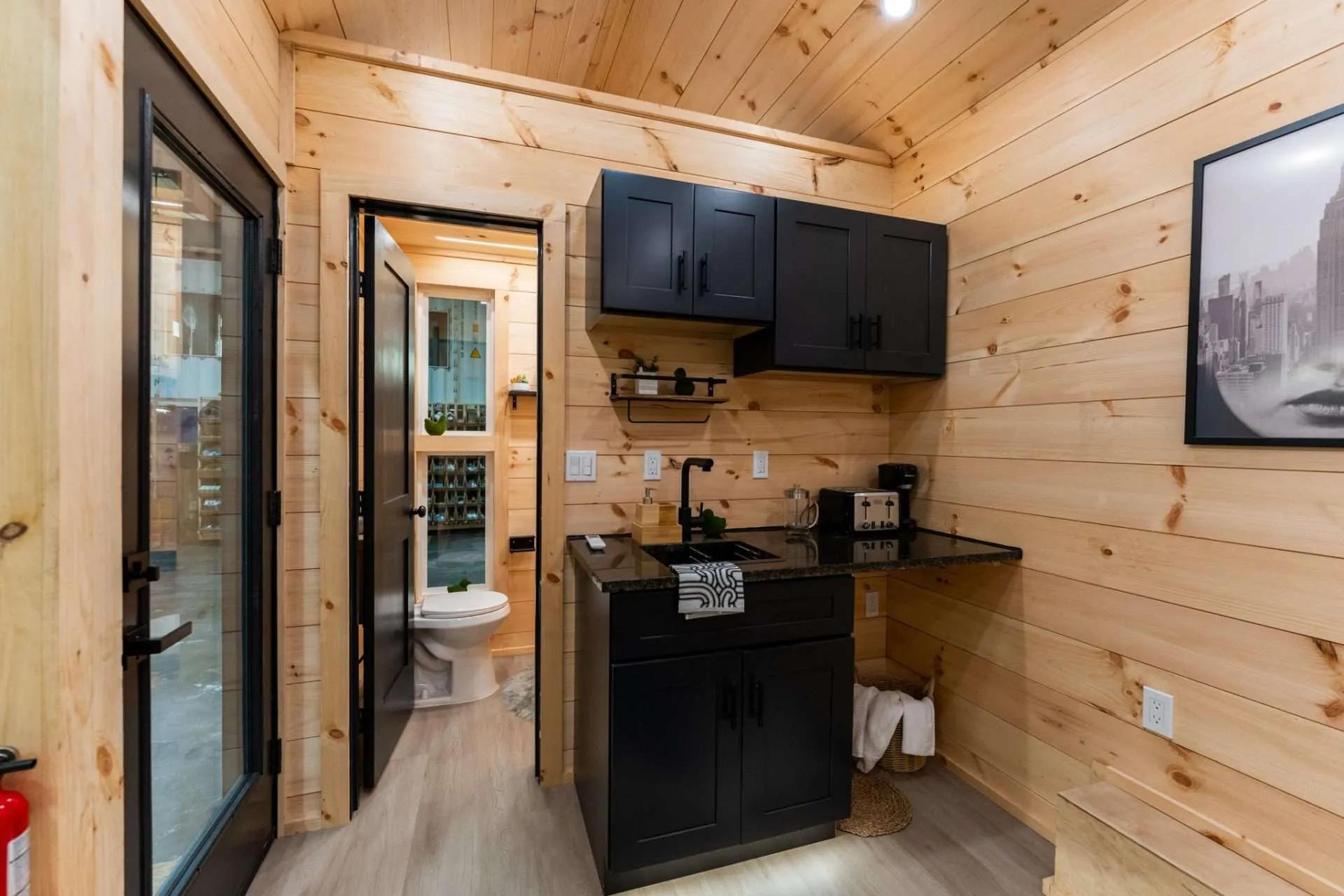 Simple Kitchenette with Black Cabinets - Kemi by Dragon Tiny Homes