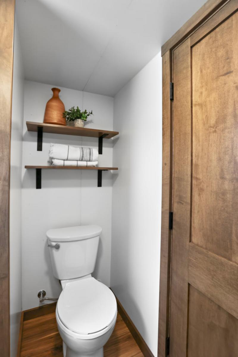 Flush Toilet with Shelves Overhead - Mi Casita by Modern Tiny Living