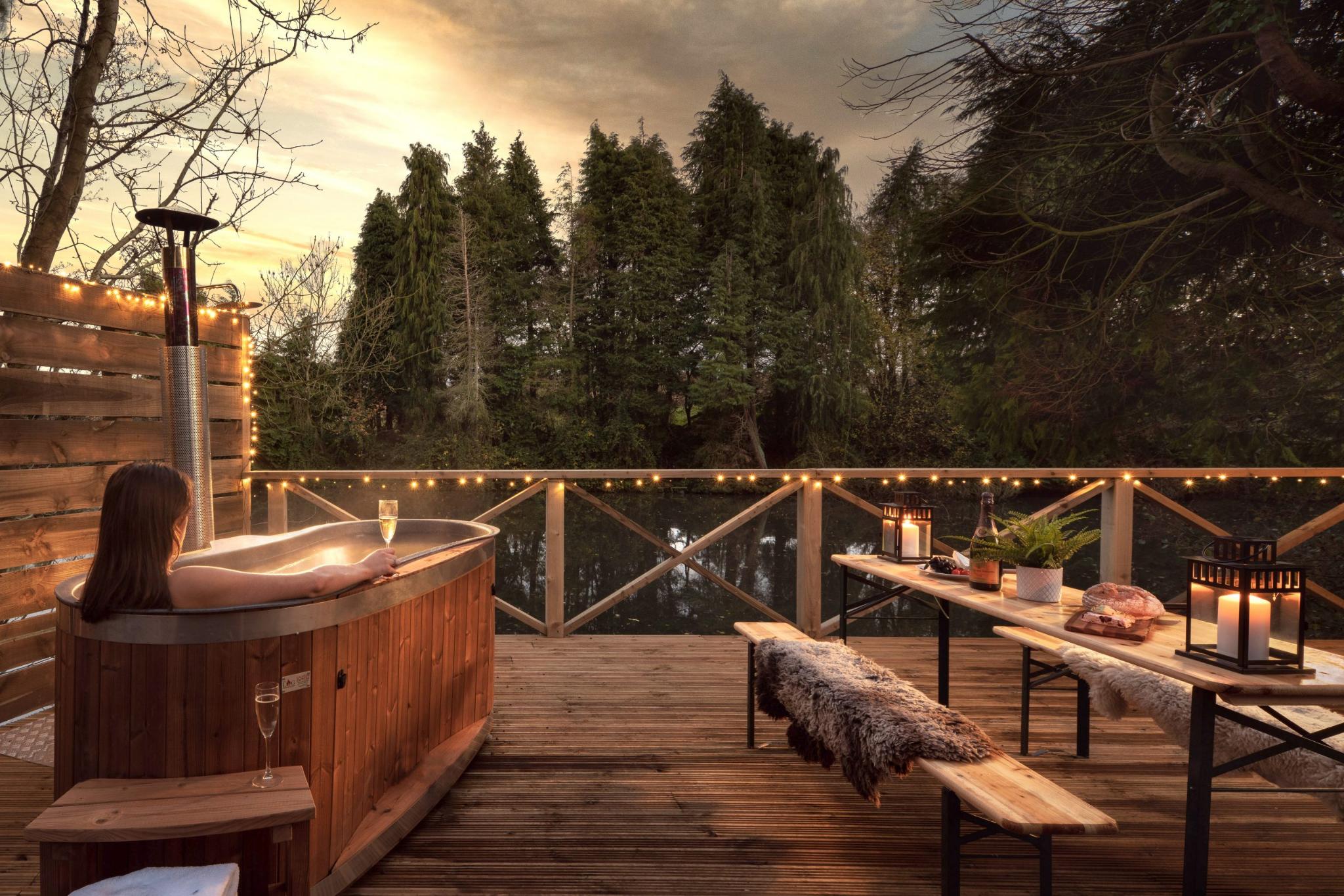 Relaxing in Hot Tub at Sunset - Shepherds Parlour at The Shepherds Hut Retreat