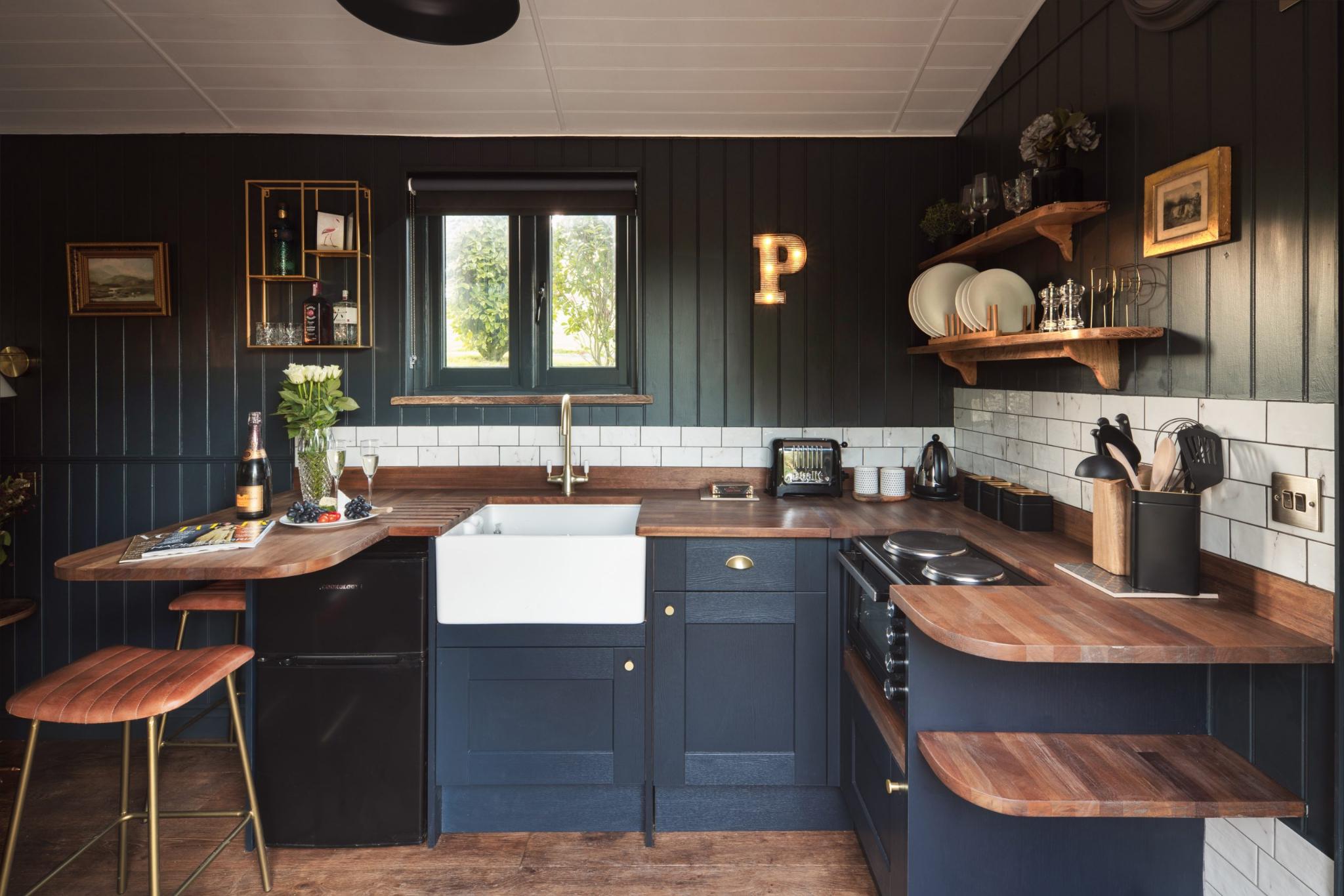 Kitchen with White Farmhouse Sink - Shepherds Parlour at The Shepherds Hut Retreat