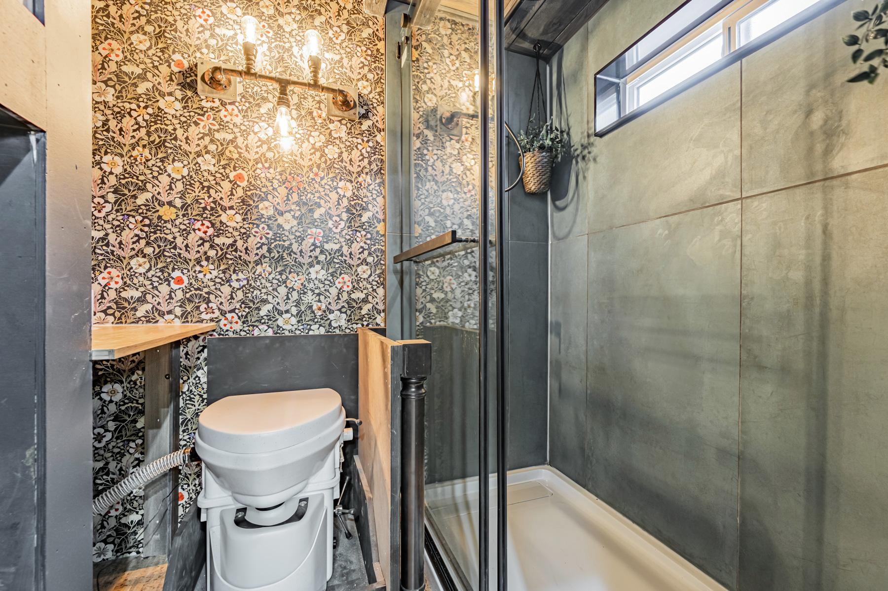 Bathroom with Glass and Tile Shower - Sherloak Homes by Acorn Tiny Homes