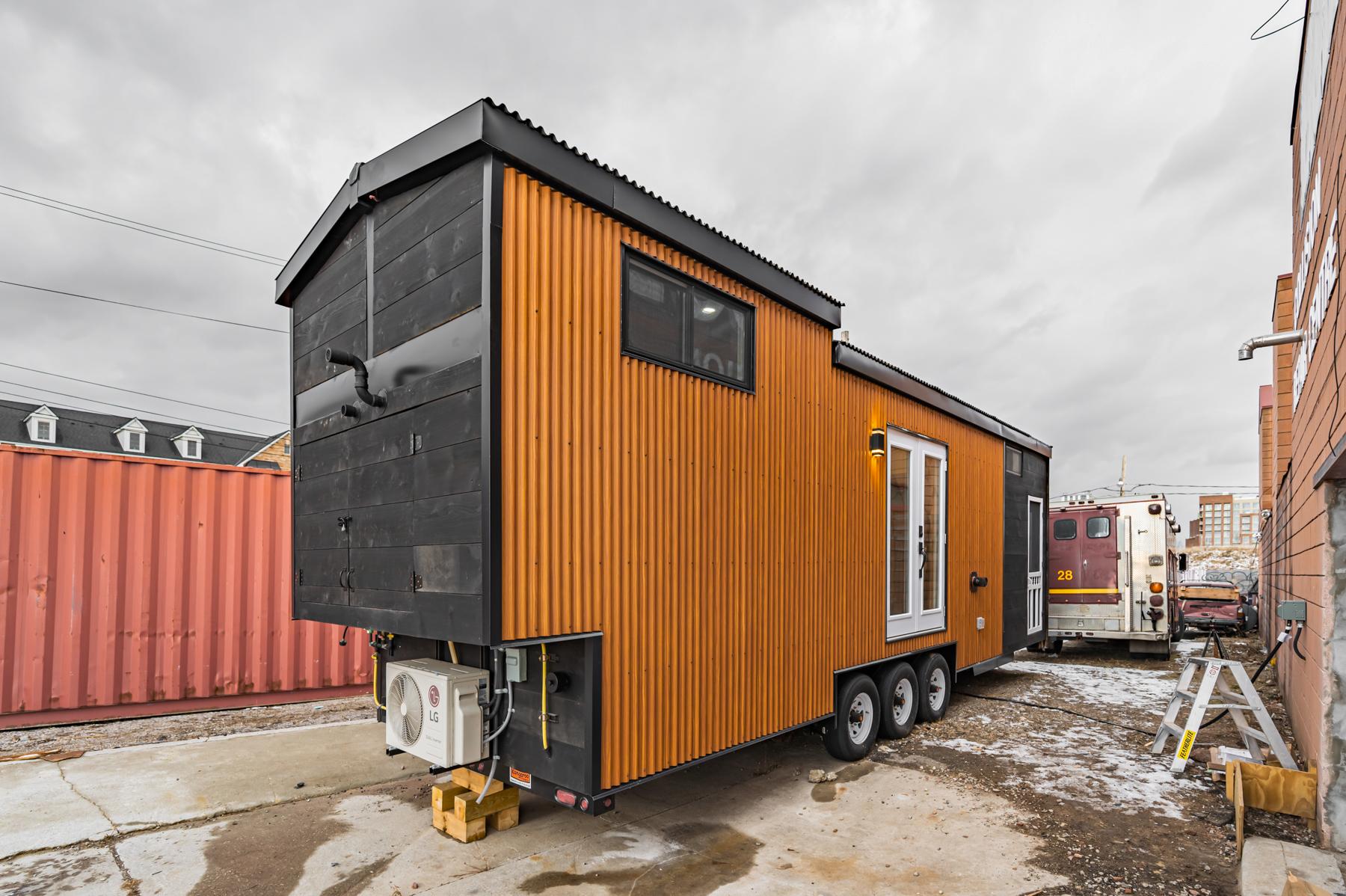 Wood Siding and Double Front Door - Sherloak Homes by Acorn Tiny Homes