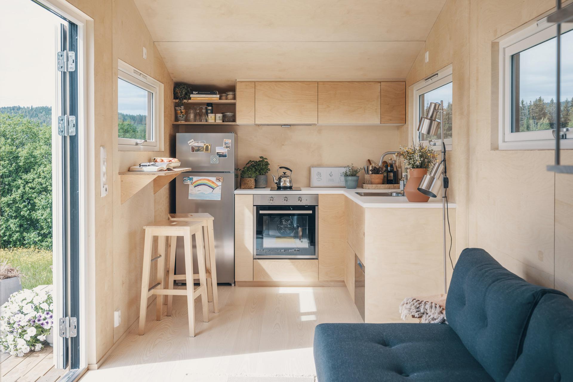 L-Shaped Kitchen with Natural Wood Finishes - Tind by Norske Mikrohus