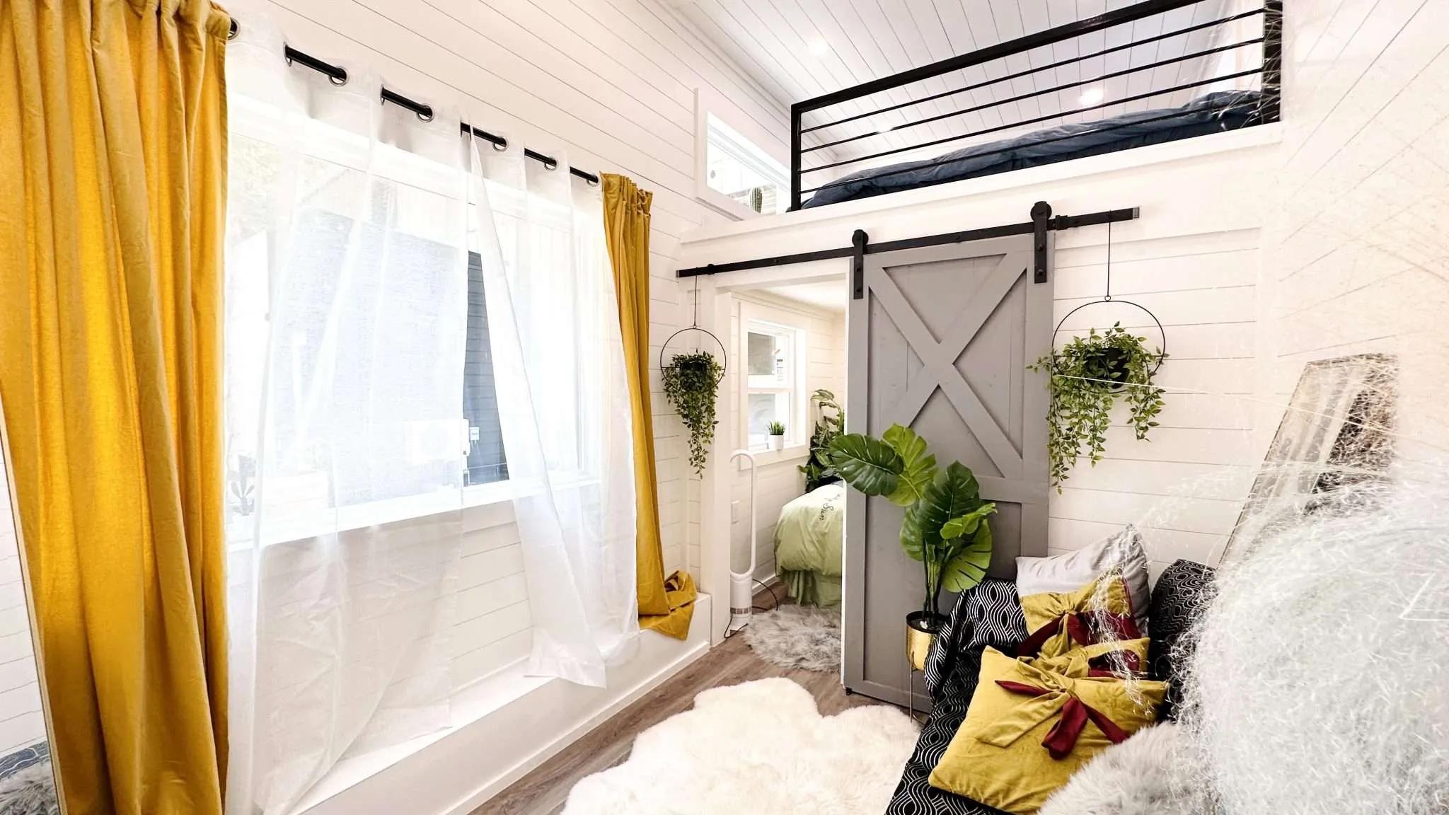 Large Window with Gold Curtains - Avalon by Dragon Tiny Homes