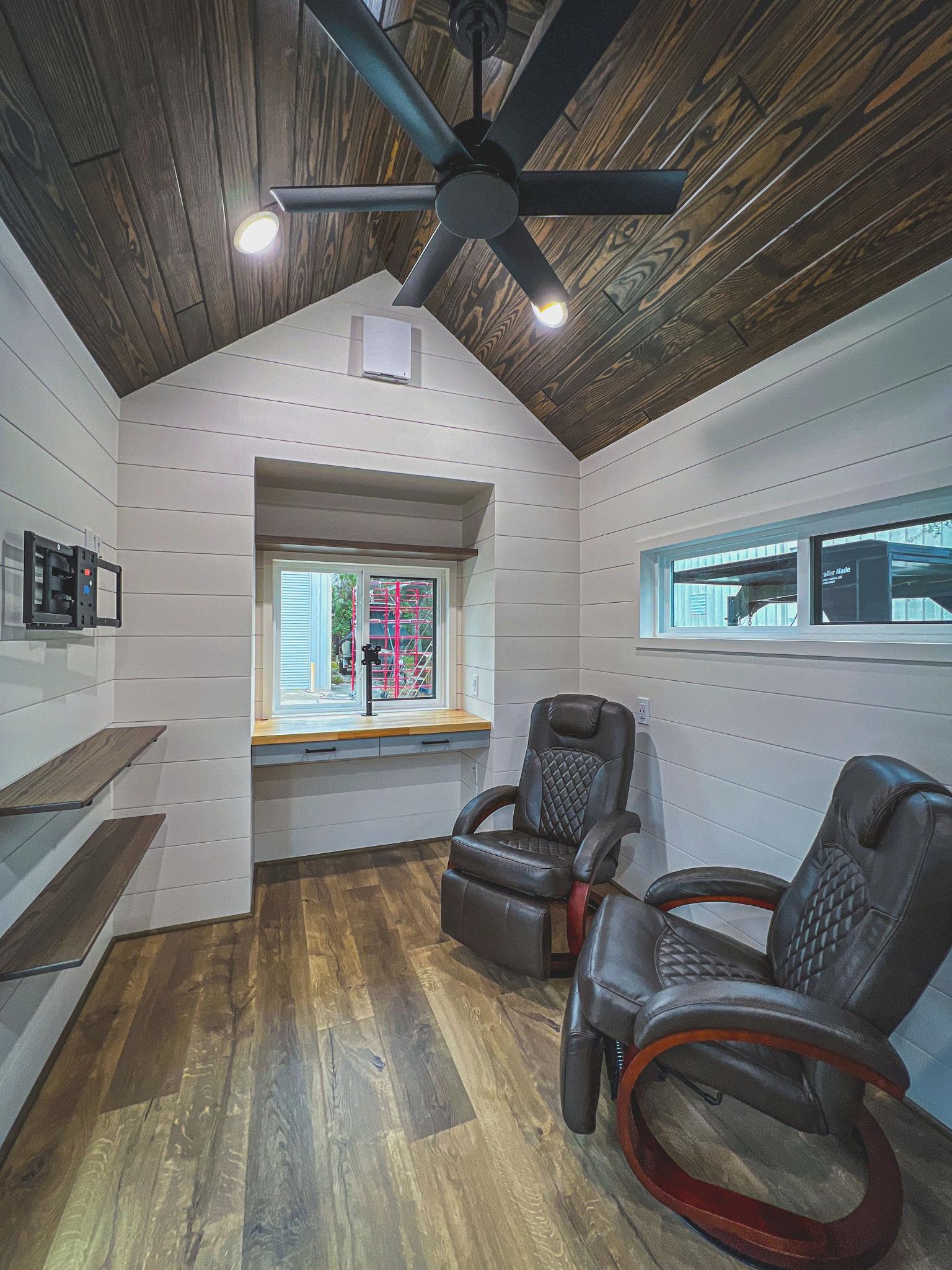 Living Room with Two Recliners and Entertainment Center - Jock Tiny House by Movable Roots