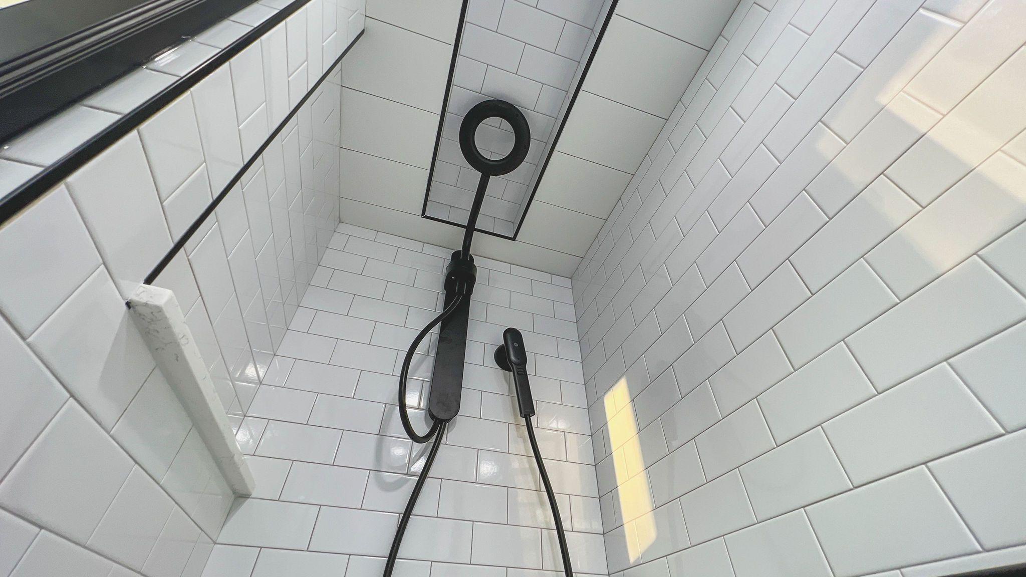 White Tile Shower - Kupersmit Tiny House by Movable Roots