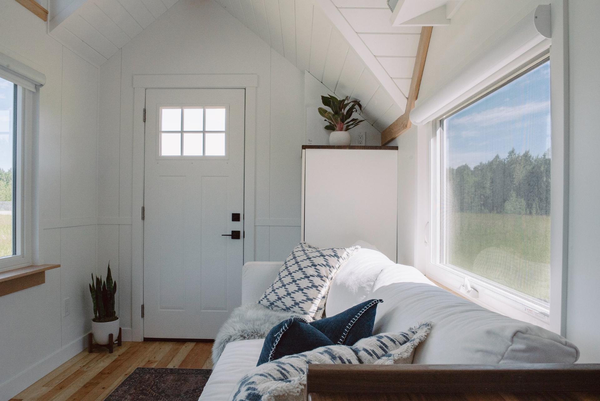 White Couch with Window Behind - Macdonald by Fritz Tiny Homes