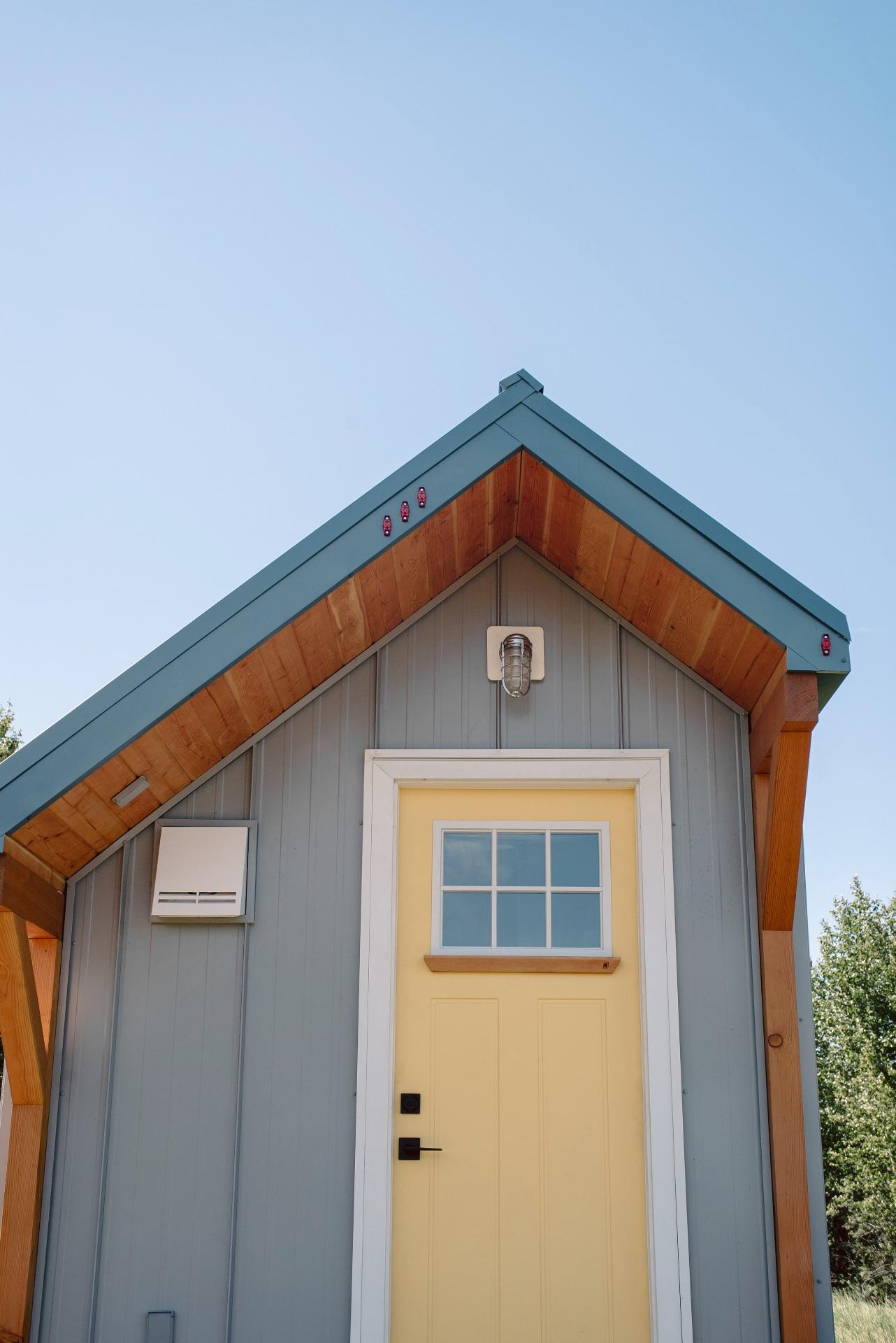 Yellow Front Door with Gray Siding - Macdonald by Fritz Tiny Homes