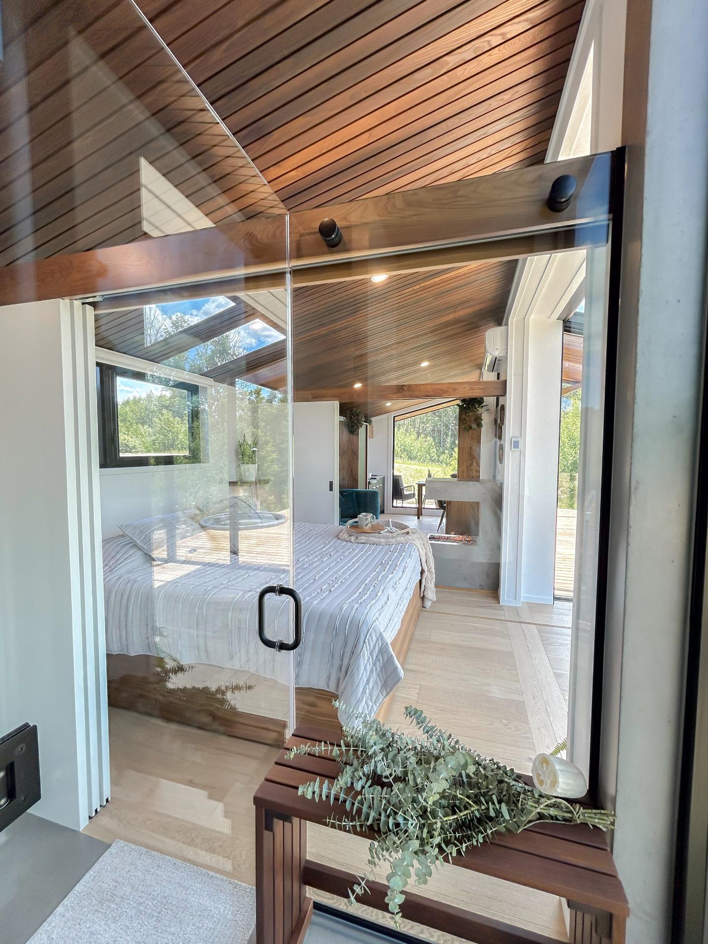 Glass Doors Leading Into Bedroom - Refuge Bay Halcyon Stay by Fritz Tiny Homes