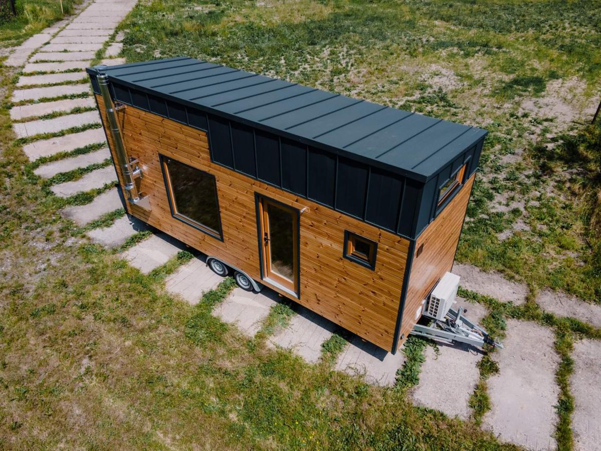 Exterior of Tiny House with Black Metal Roof and Wood Siding - Elbrus by Berghaus