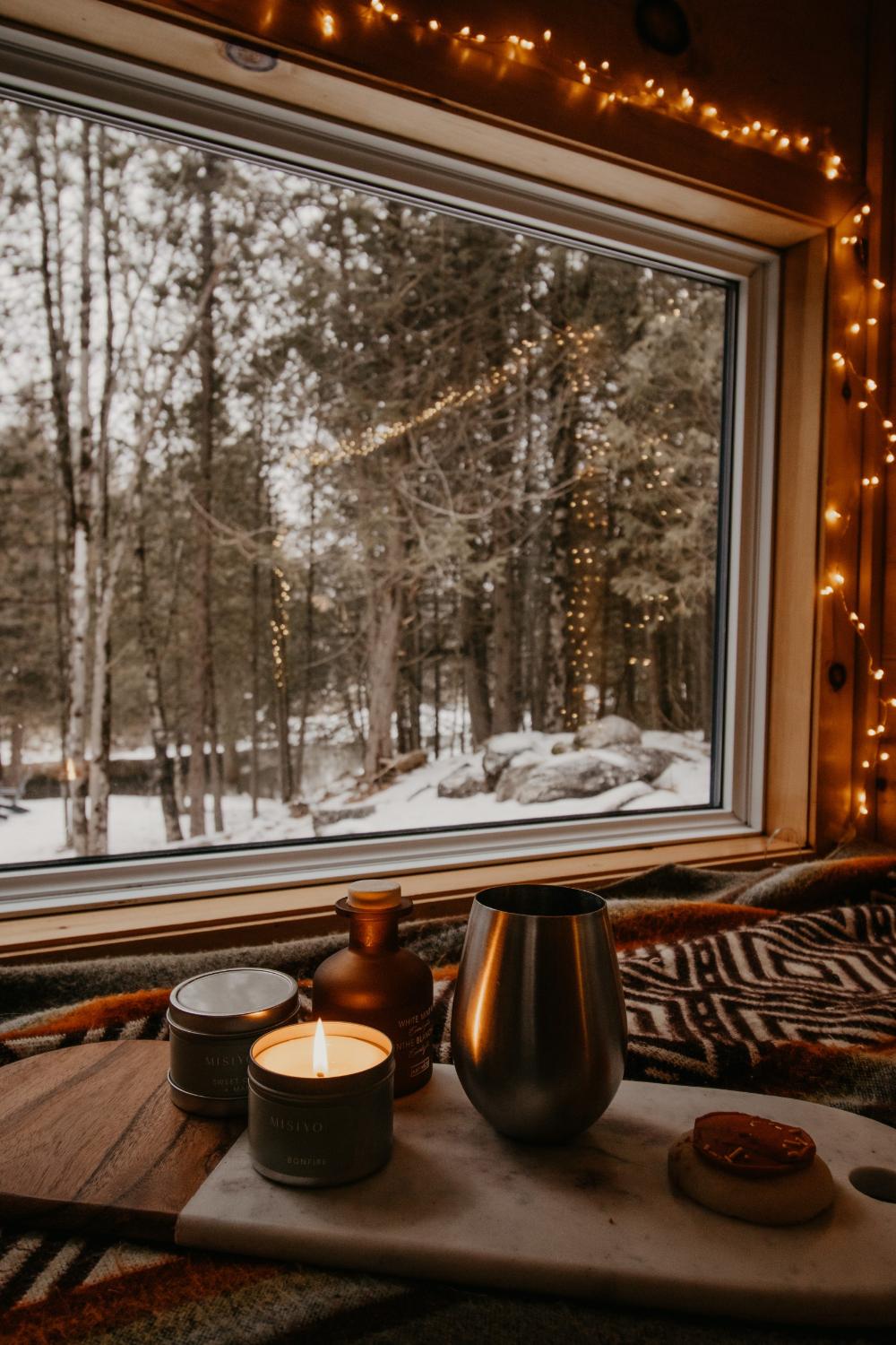 Soft Glowing Candles and Lights with Winter Scene Outside Window - Ember by Cabinscape